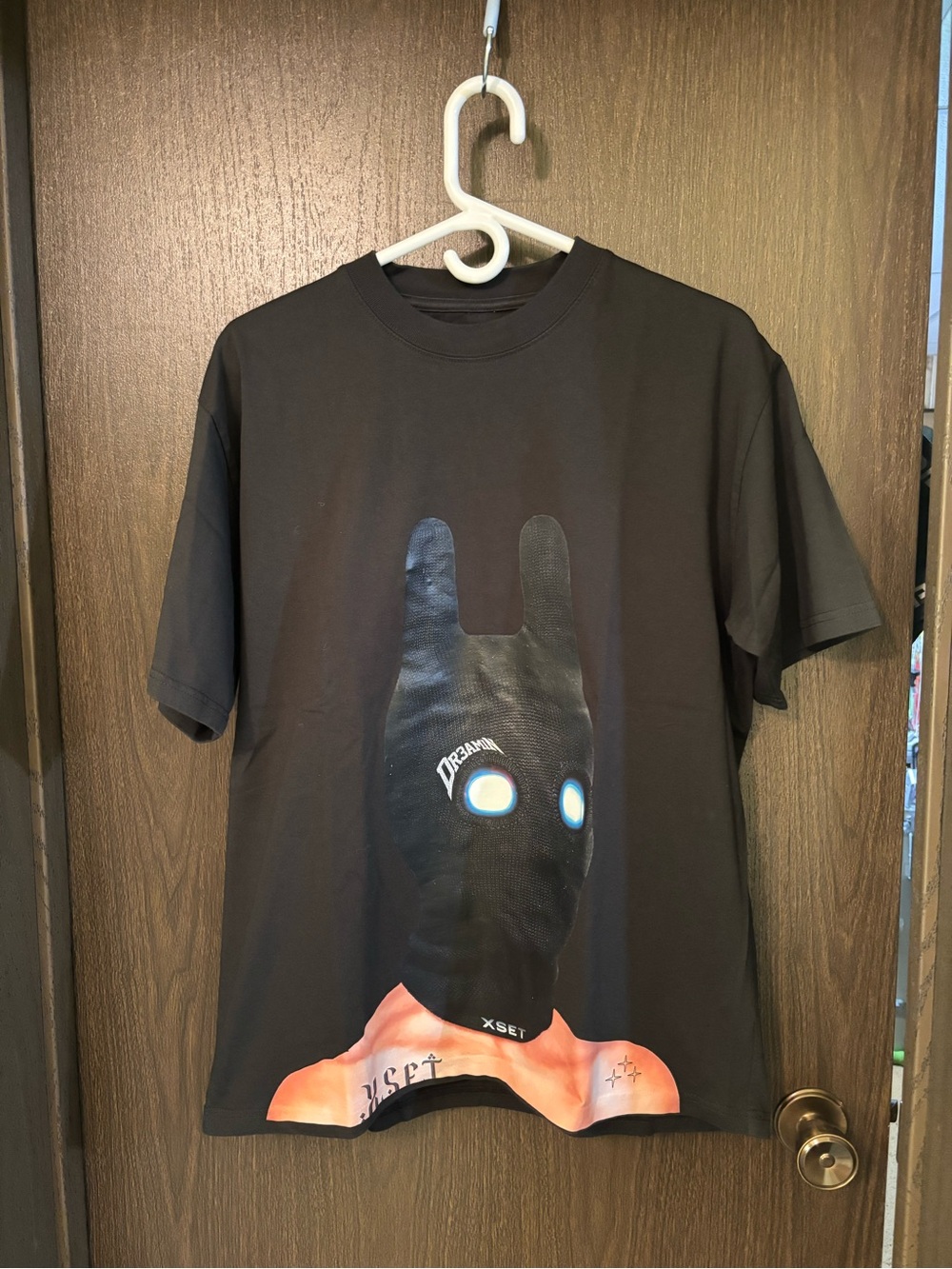 XSETxClix Graphic Tee with Masked Character Print